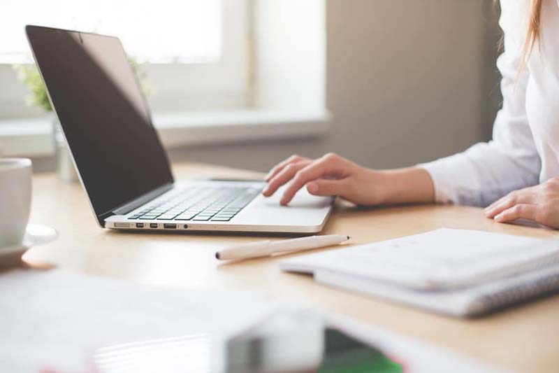 An editor working on her laptop